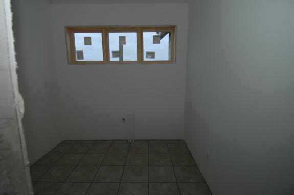 Laundry room with tile floor